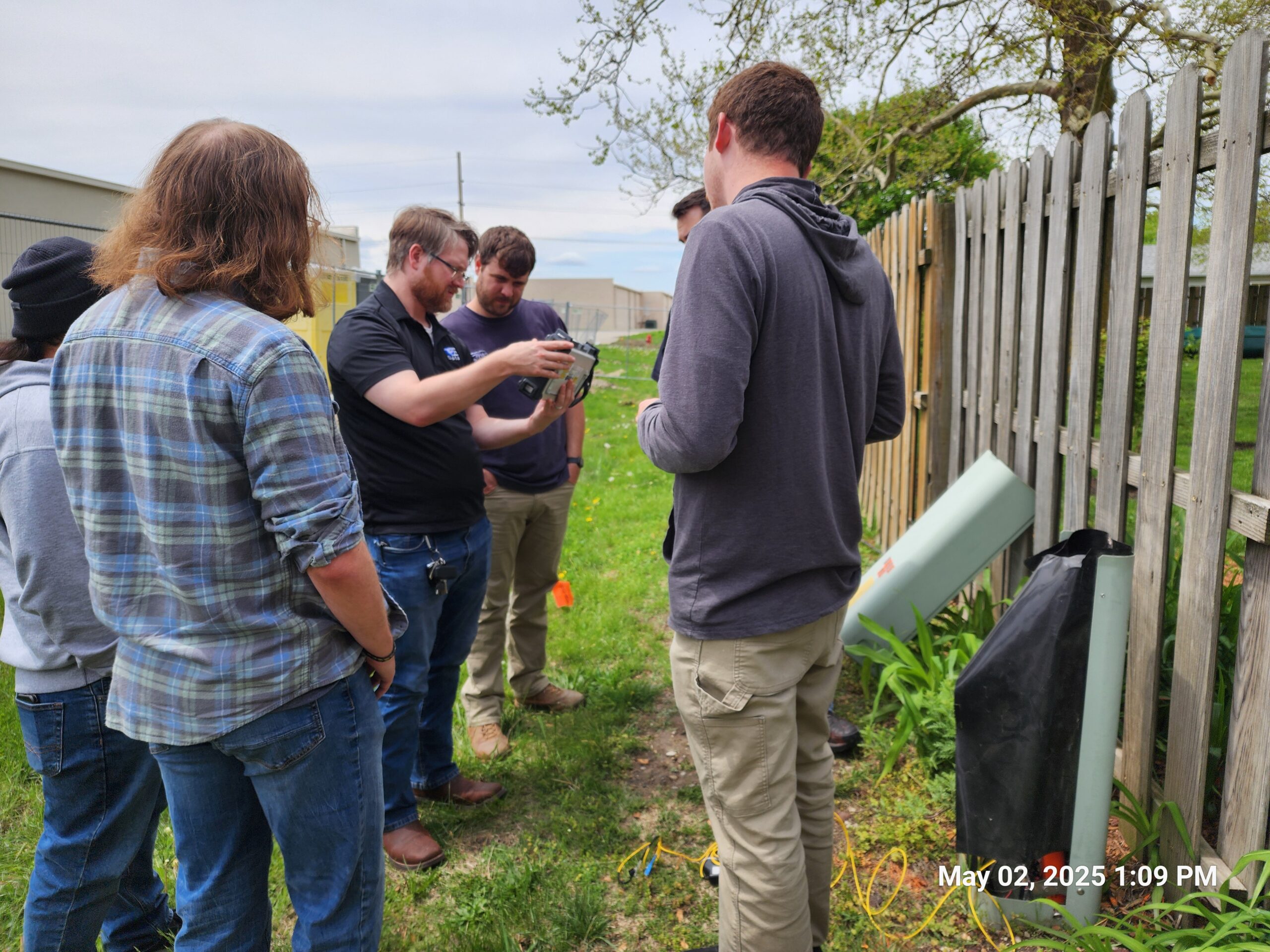 BDI students working with fiber optic equipment during a hands-on certification class